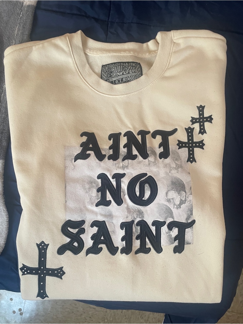 Ain't No Saint Cream Graphic unisex Sweatshirt